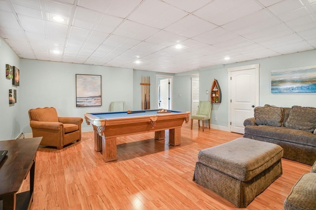 24 Jae Road Falmouth, MA 02556 - Photo 29 of 32 a living room with furniture and a wooden floor