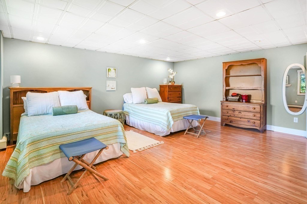 24 Jae Road Falmouth, MA 02556 - Photo 30 of 32 a bedroom with two beds and a couch