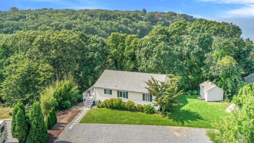 24 Jae Road Falmouth, MA 02556 - Photo 4 of 32 a view of a house with a garden