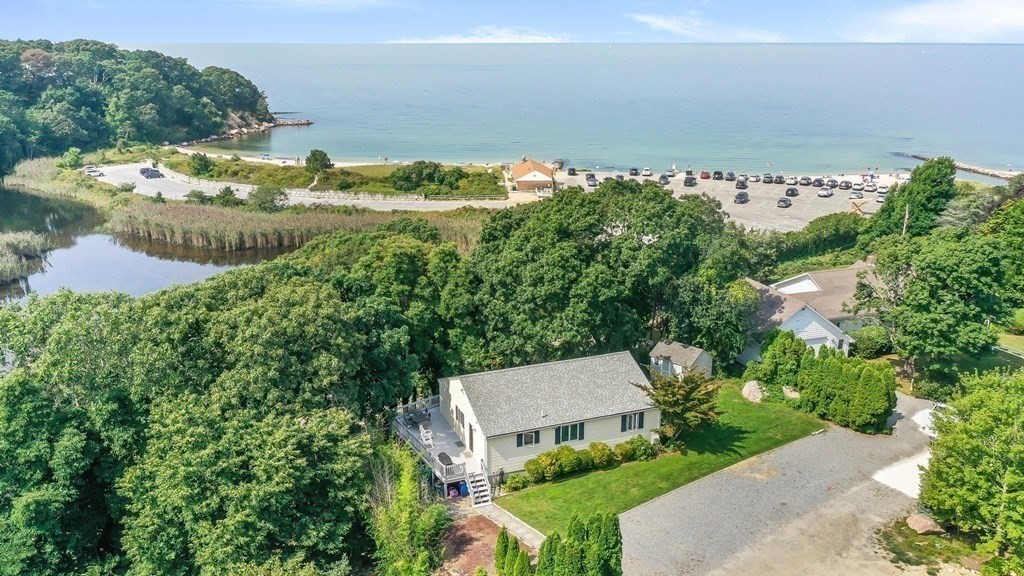 24 Jae Road Falmouth, MA 02556 - Photo 5 of 32 an aerial view of a house with a yard and lake view