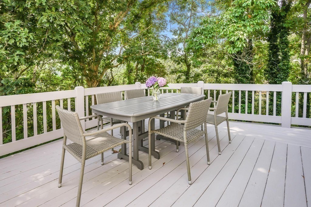 24 Jae Road Falmouth, MA 02556 - Photo 7 of 32 a view of a chairs and table on the deck