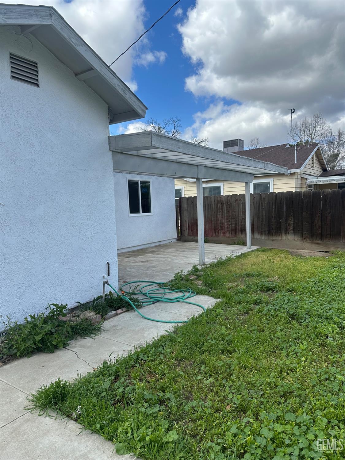 Undisclosed Address Delano, CA 93215 - Photo 12 of 13 a front view of house with yard and green space