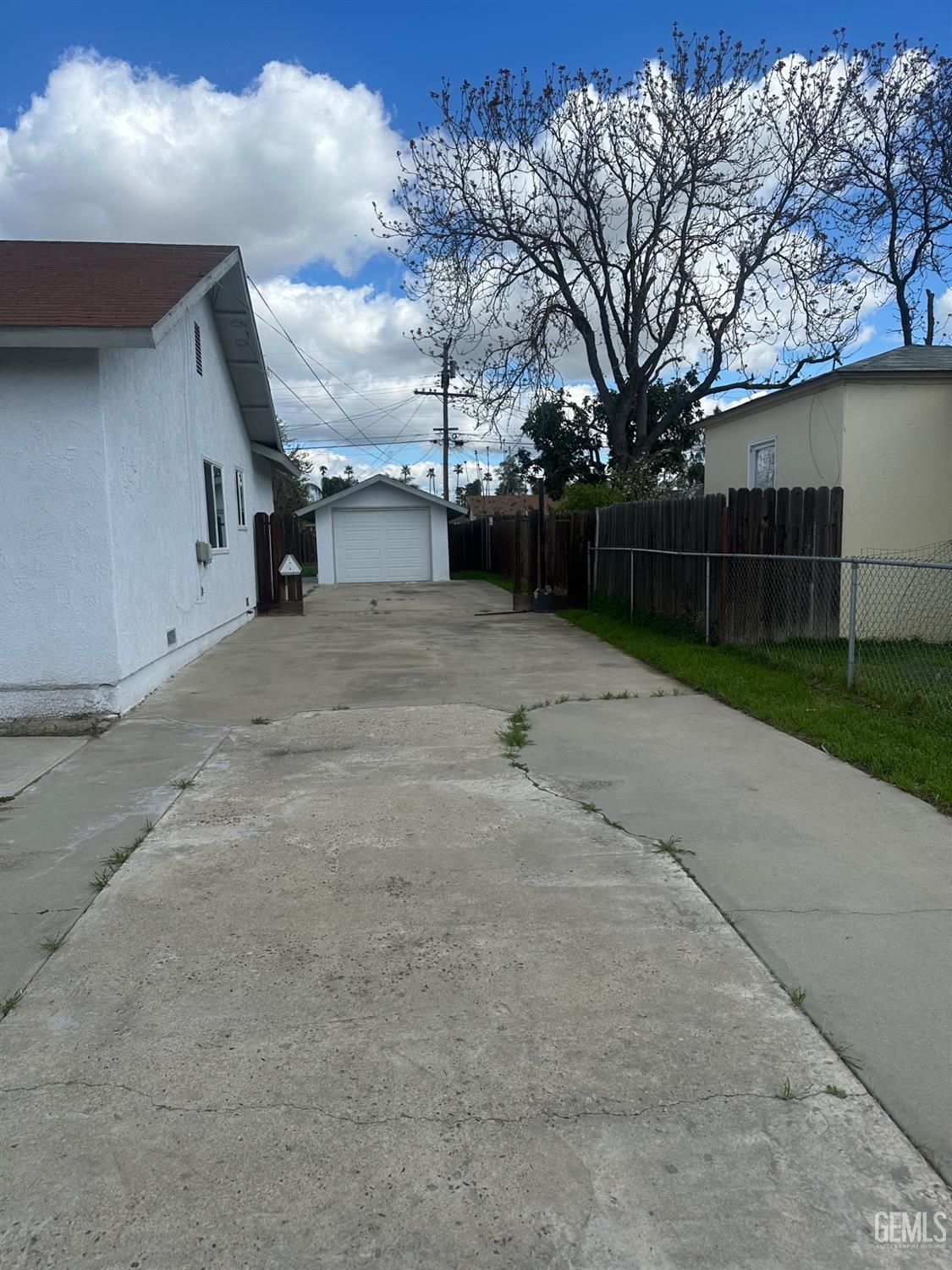 Undisclosed Address Delano, CA 93215 - Photo 2 of 13 a view of outdoor space with wooden fence