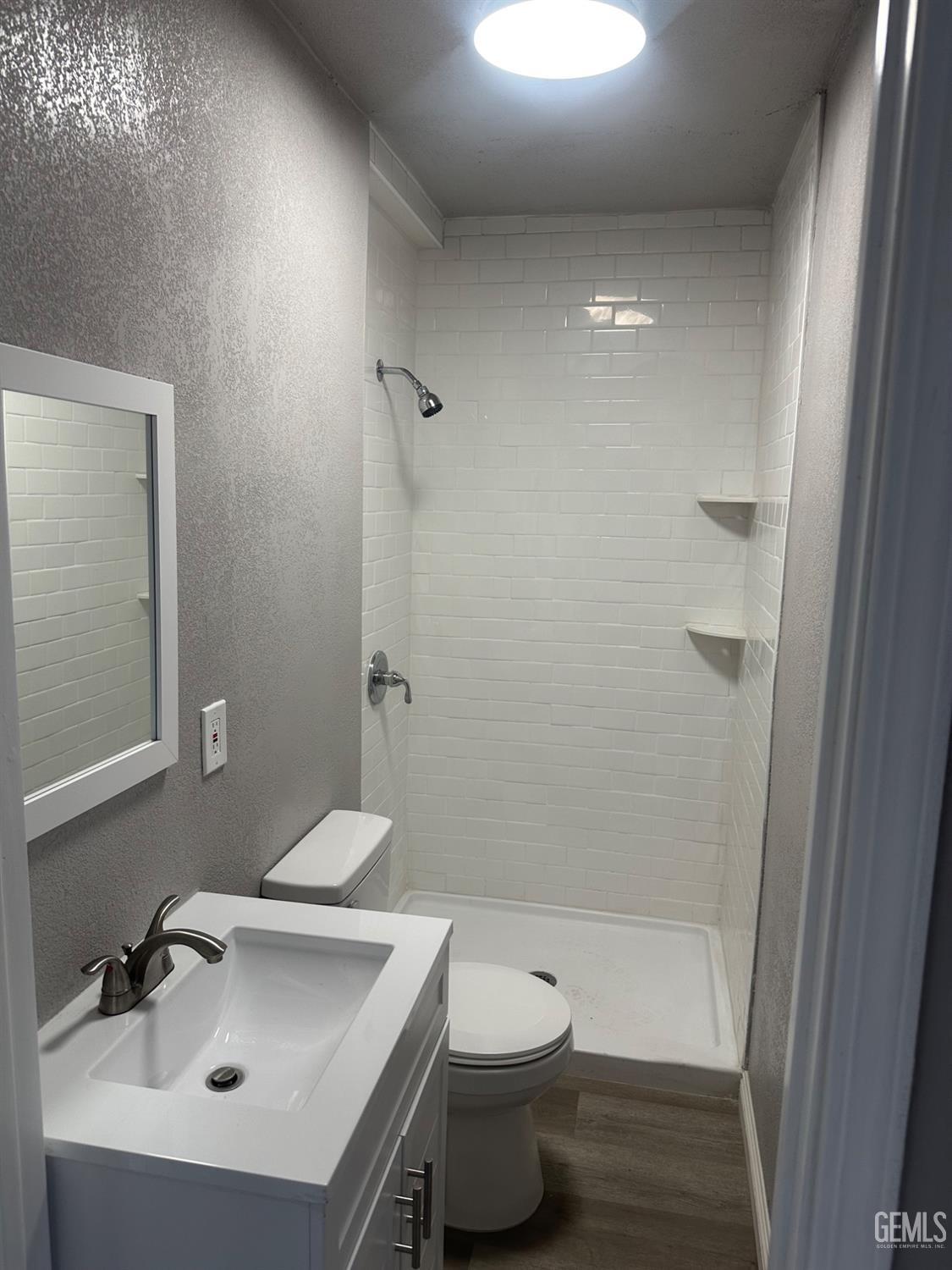 Undisclosed Address Delano, CA 93215 - Photo 7 of 13 a bathroom with a sink toilet and shower