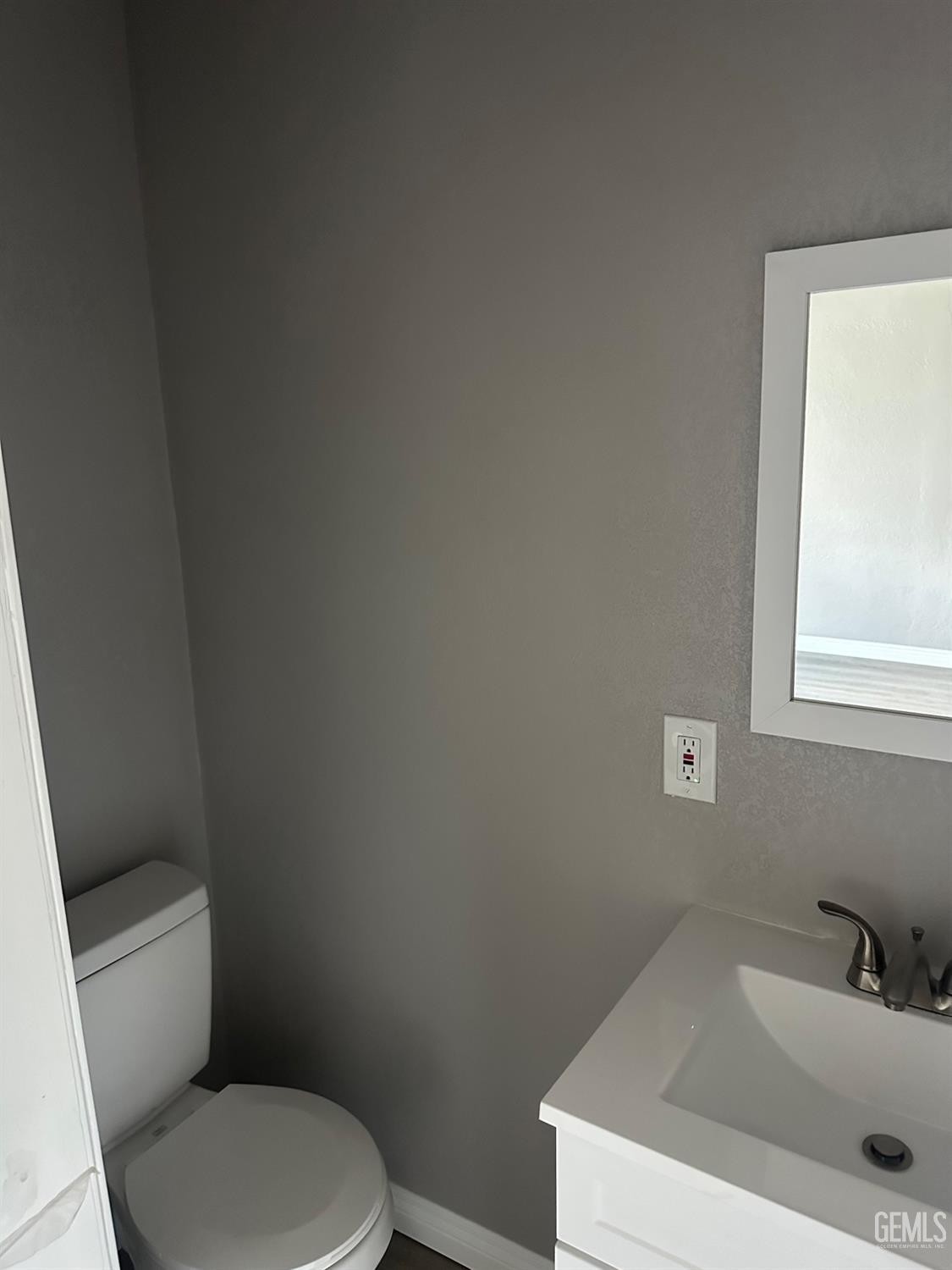 Undisclosed Address Delano, CA 93215 - Photo 8 of 13 a white toilet sitting next to a bathroom sink