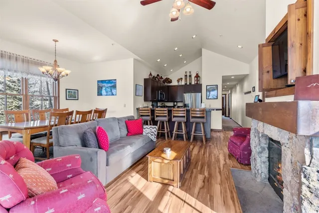 a living room with furniture and kitchen view