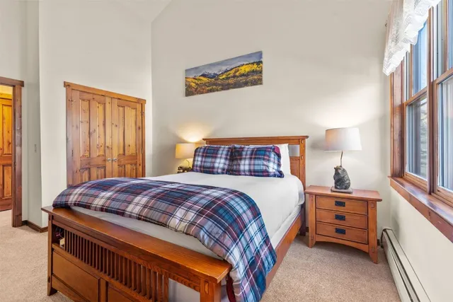 a bedroom with a bed and a cabinets