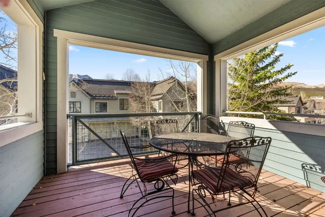 a view of balcony with furniture and wooden floor