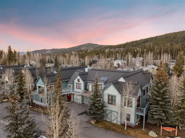 a view of a town with large trees
