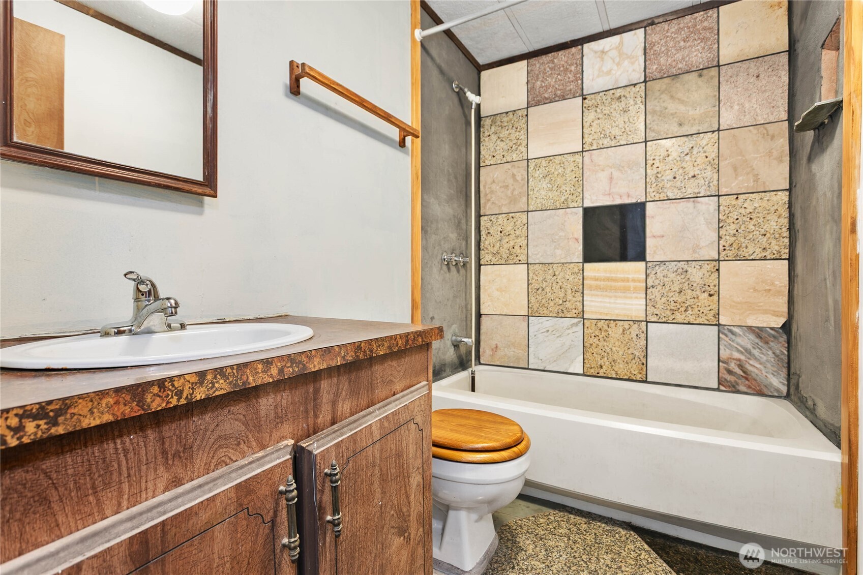 4015 Eliza Avenue, Unit 120 Bellingham, WA 98226 - Photo 18 of 26 a bathroom with a sink a toilet and shower