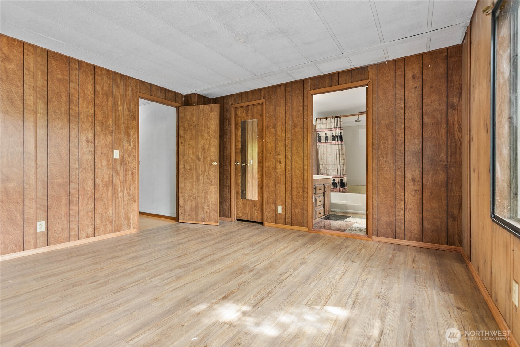 4015 Eliza Avenue, Unit 120 Bellingham, WA 98226 - Photo 21 of 26 a view of a room with wooden floor and a window