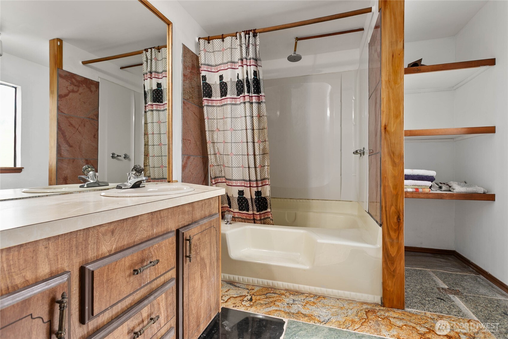 4015 Eliza Avenue, Unit 120 Bellingham, WA 98226 - Photo 22 of 26 a bathroom with a tub sink and mirror