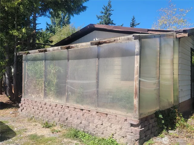 front view of a house with a tree