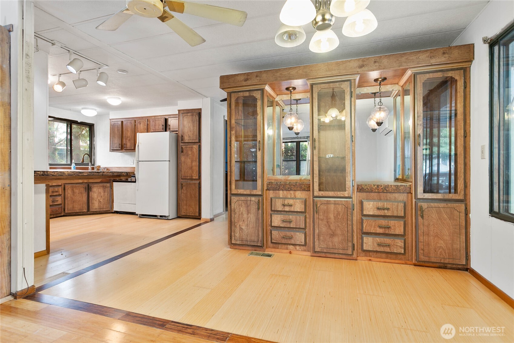4015 Eliza Avenue, Unit 120 Bellingham, WA 98226 - Photo 6 of 26 a view of a hallway with wooden cabinet