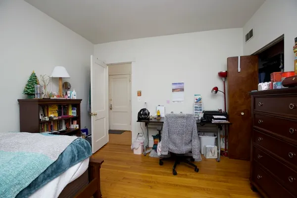 a bedroom with furniture and a fireplace