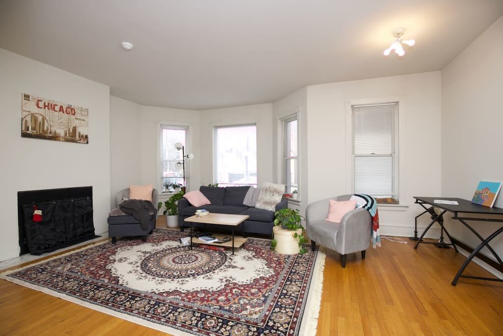 6717 North Sheridan Road, Unit 2S Chicago, IL 60626 - Photo 9 of 20 a living room with furniture and a fireplace