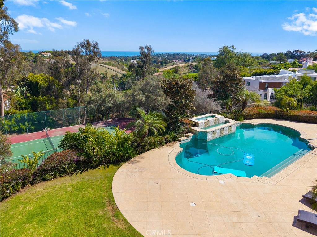 6000 Cavalleri Road Malibu, CA 90265 - Photo 12 of 44 a view of a swimming pool with a yard