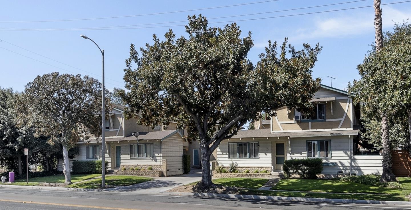 a front view of a house with garden