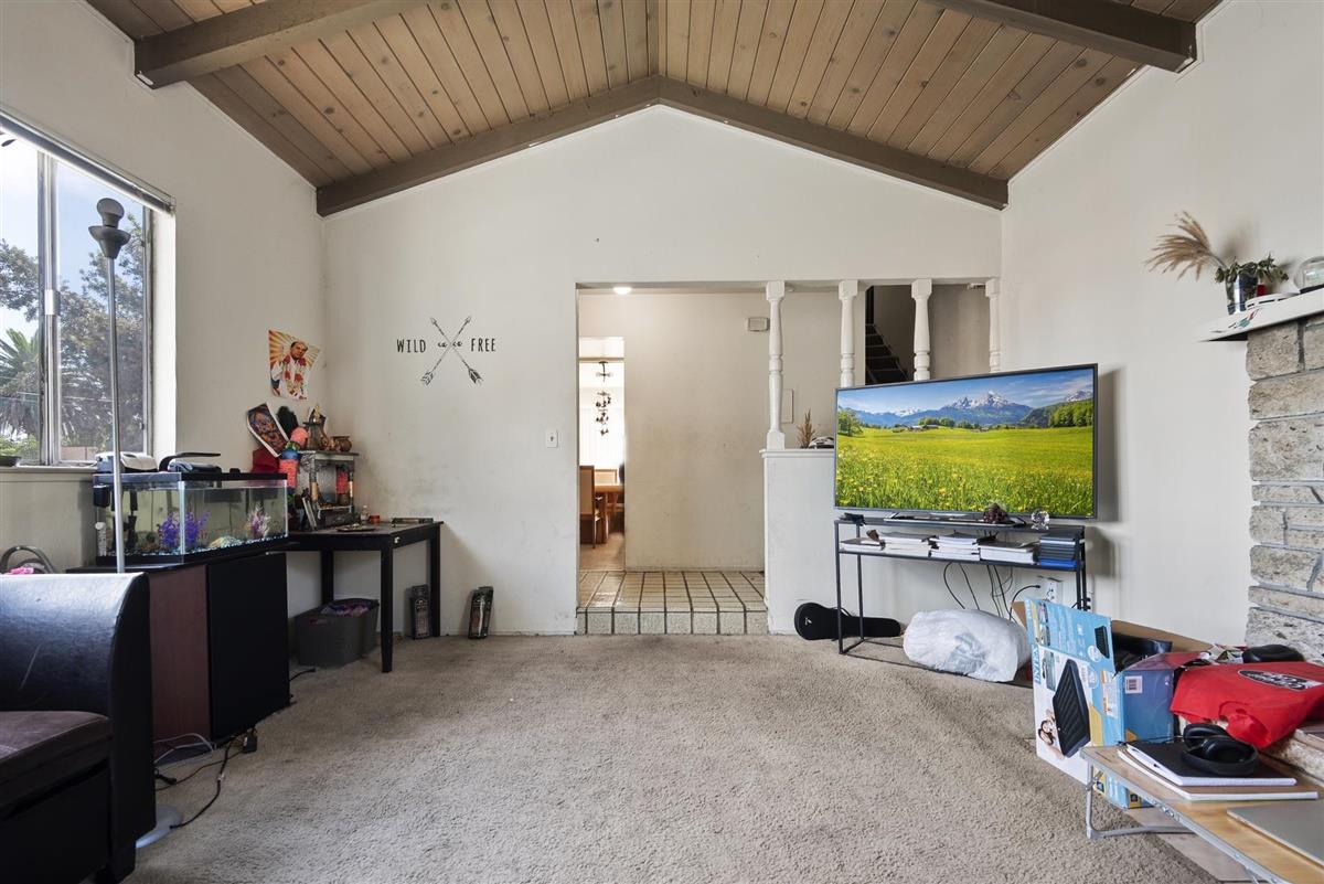1367-1371 South Wolfe Road Sunnyvale, CA 94087 - Photo 21 of 47 a view of a livingroom with furniture and a flat screen tv