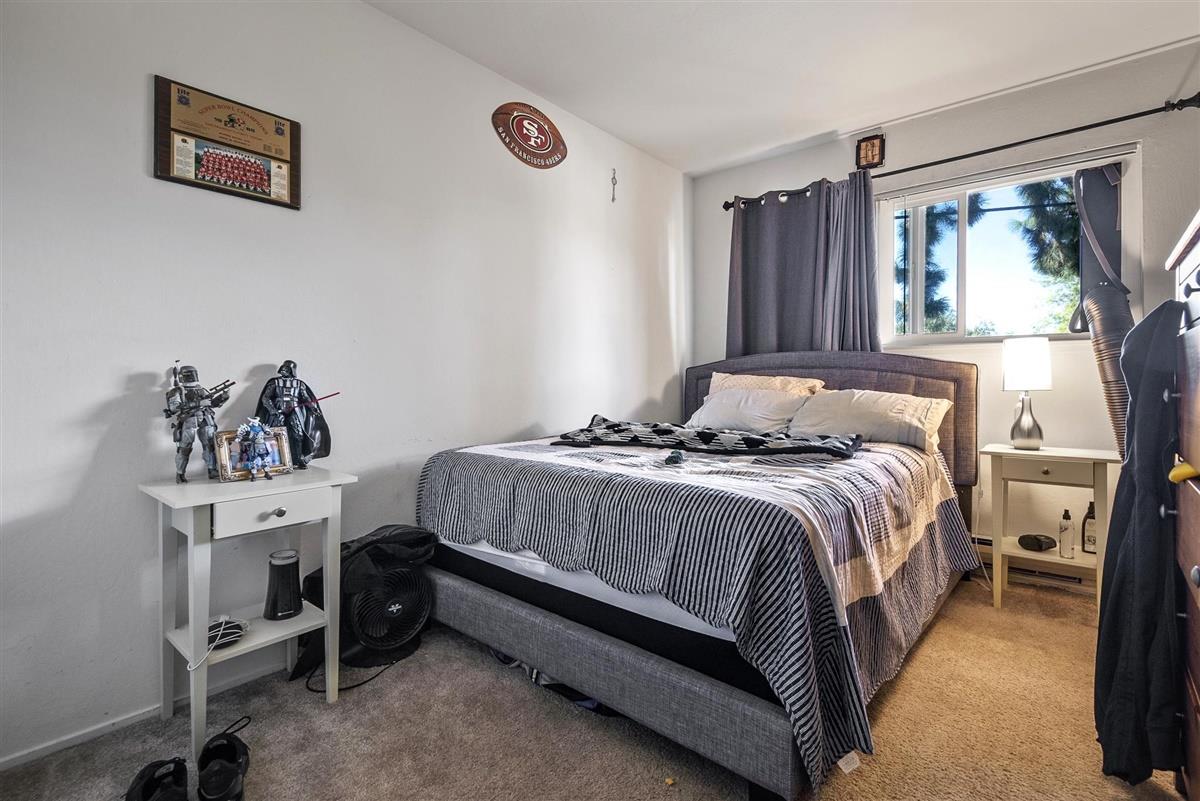 1367-1371 South Wolfe Road Sunnyvale, CA 94087 - Photo 22 of 47 a bedroom with a bed and a window