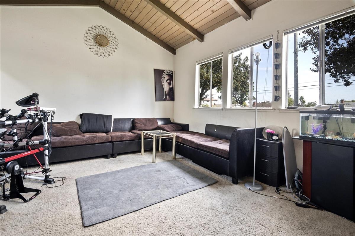 1367-1371 South Wolfe Road Sunnyvale, CA 94087 - Photo 26 of 47 a living room with furniture a window and a painting