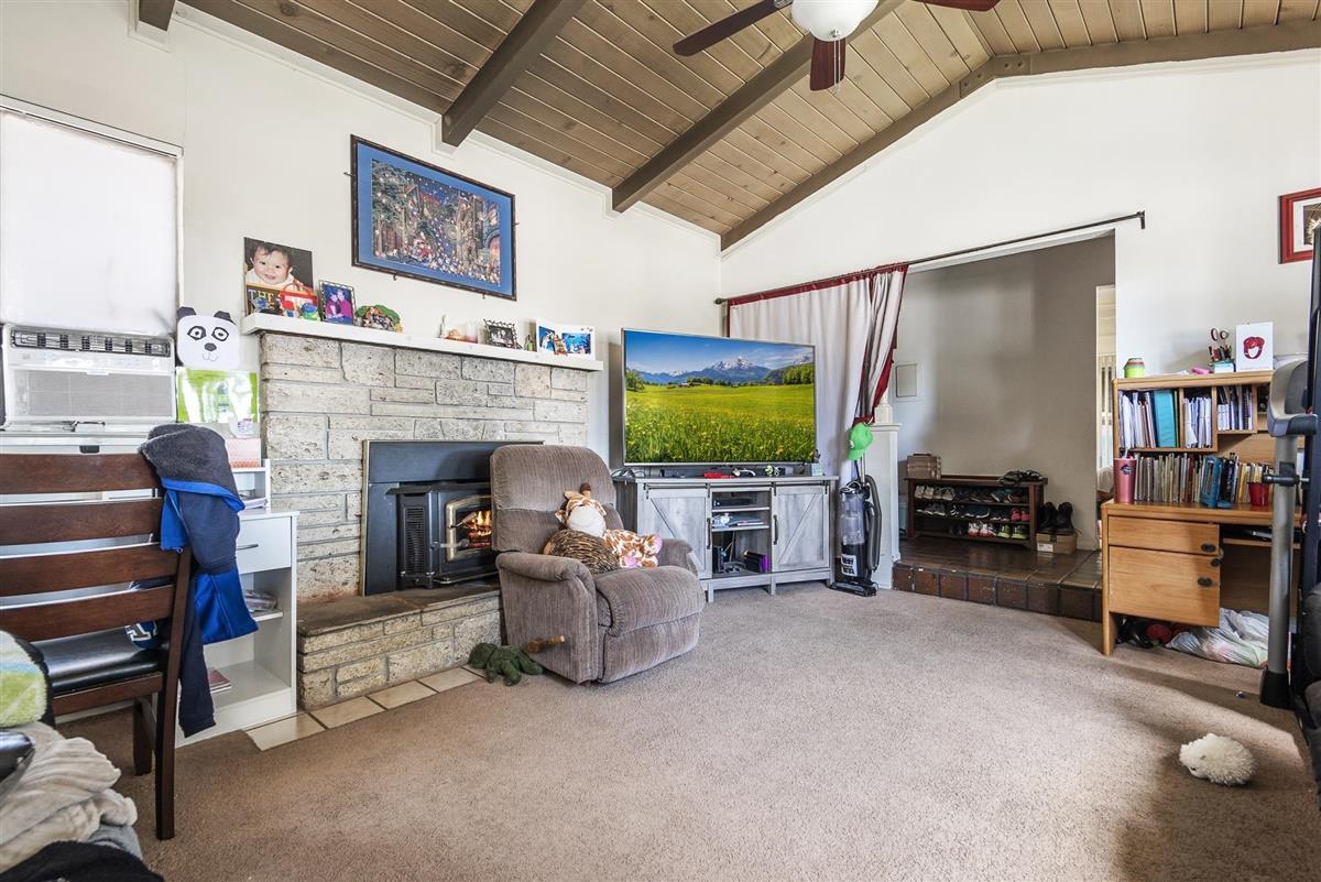 1367-1371 South Wolfe Road Sunnyvale, CA 94087 - Photo 27 of 47 a living room with furniture and a flat screen tv