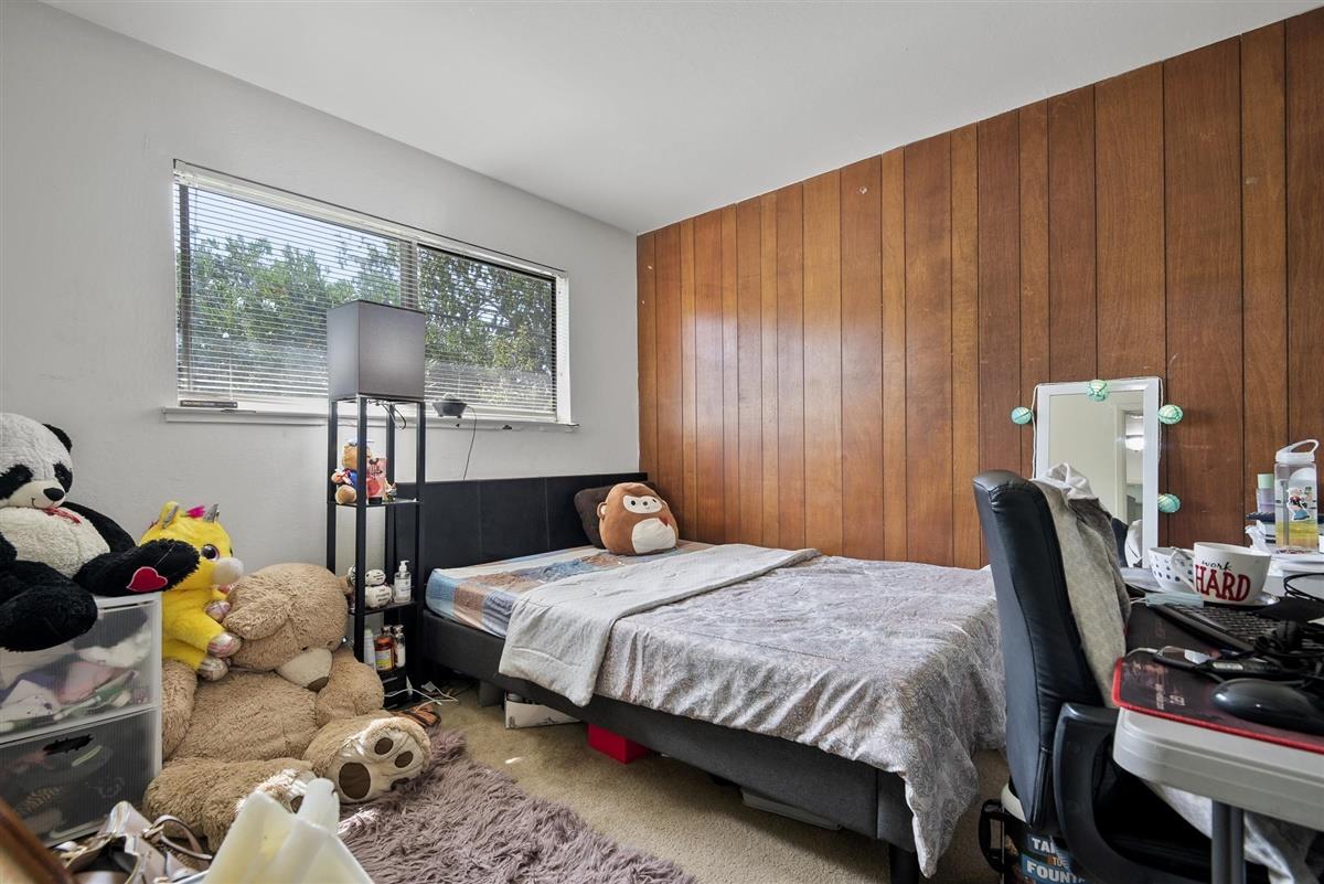 1367-1371 South Wolfe Road Sunnyvale, CA 94087 - Photo 29 of 47 a bedroom with a bed and large windows