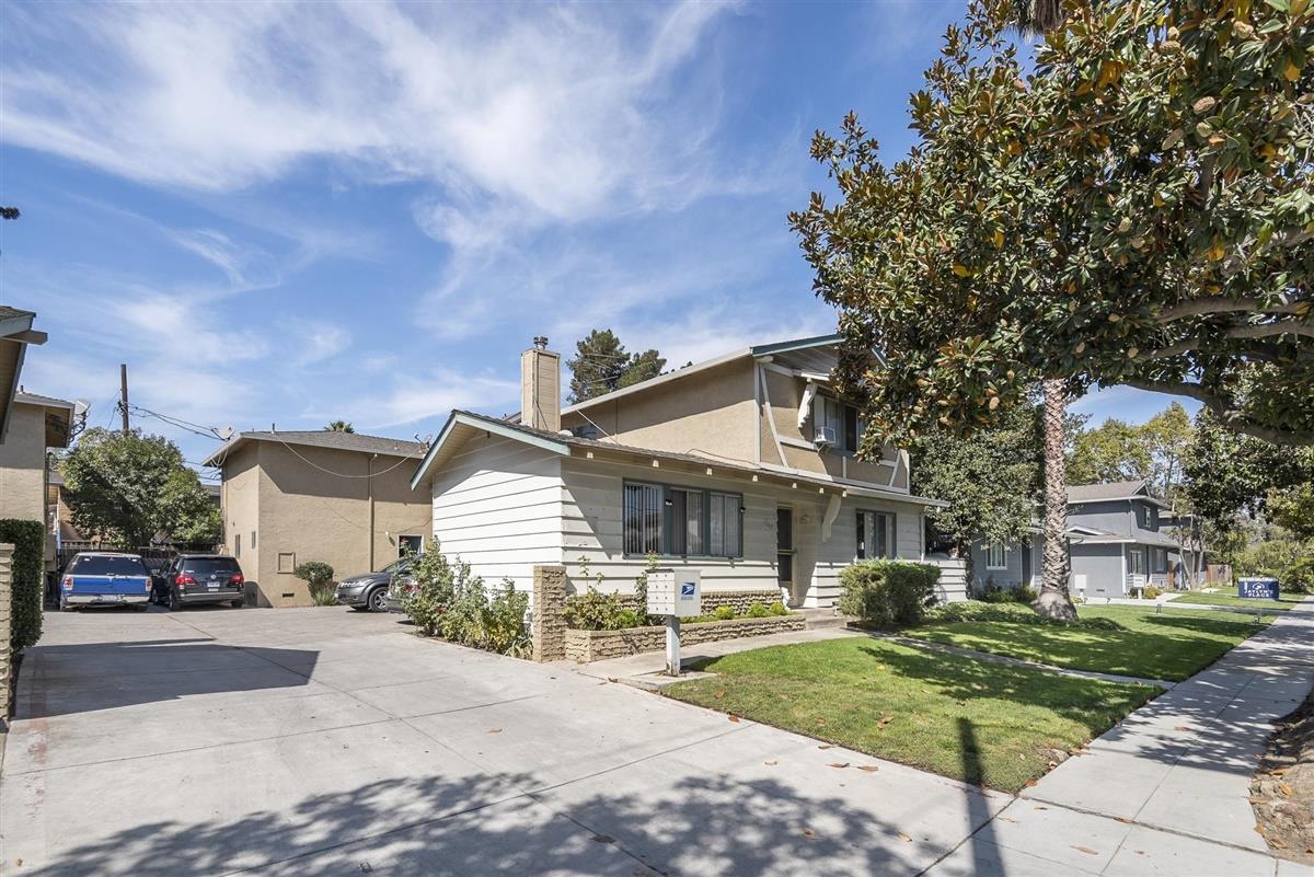 1367-1371 South Wolfe Road Sunnyvale, CA 94087 - Photo 30 of 47 a front view of a house with a yard and potted plants