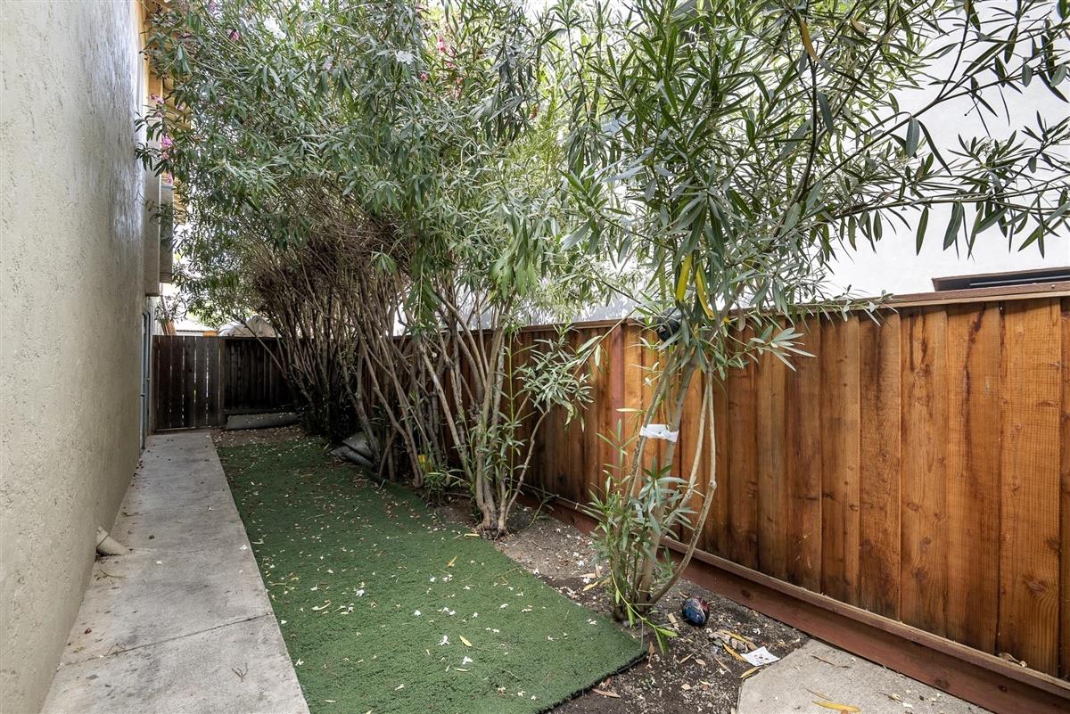 1367-1371 South Wolfe Road Sunnyvale, CA 94087 - Photo 32 of 47 a backyard of a house with table and chairs