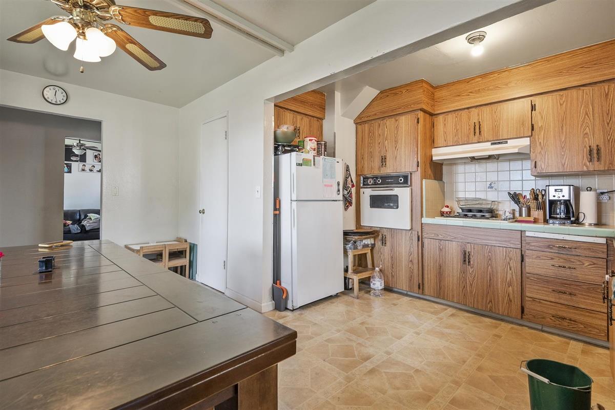 1367-1371 South Wolfe Road Sunnyvale, CA 94087 - Photo 33 of 47 a kitchen with a refrigerator and a sink