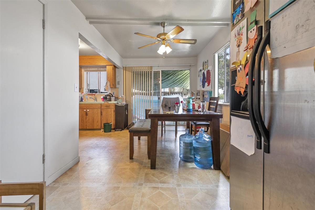 1367-1371 South Wolfe Road Sunnyvale, CA 94087 - Photo 34 of 47 a dining room with furniture and a floor to ceiling window