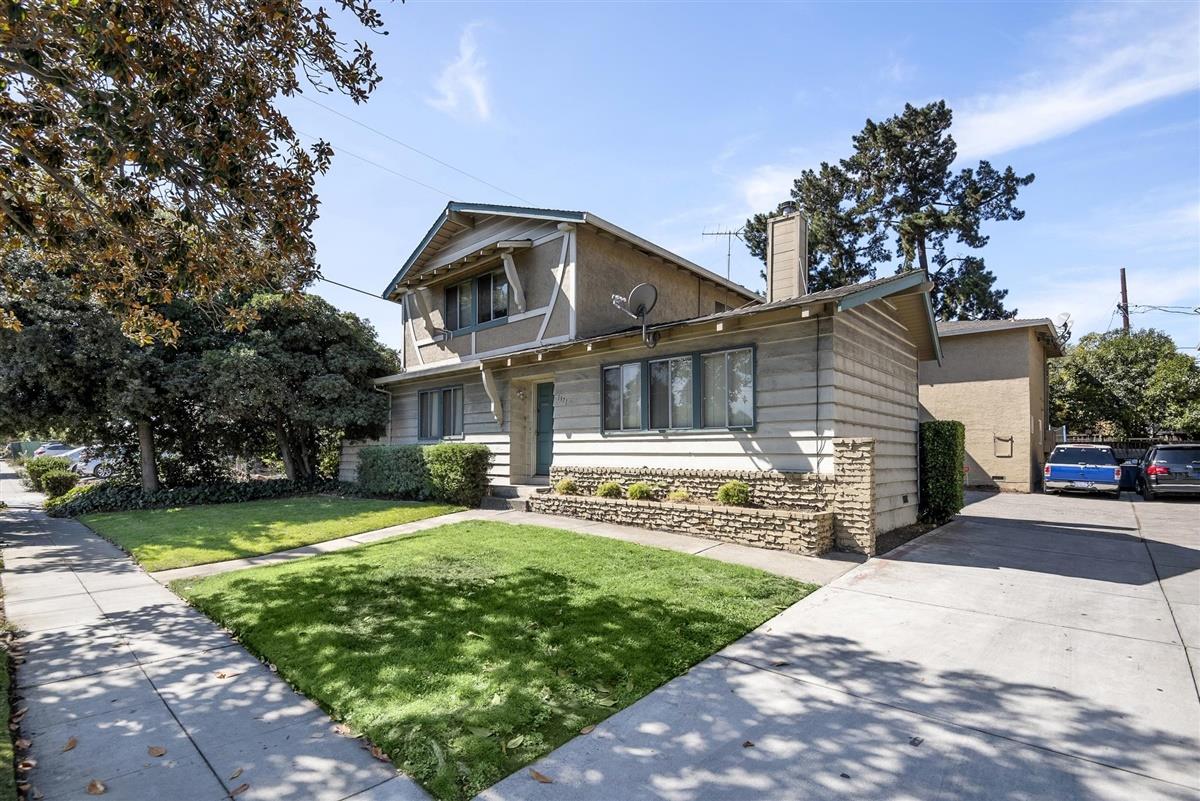 1367-1371 South Wolfe Road Sunnyvale, CA 94087 - Photo 37 of 47 a front view of a house with a yard