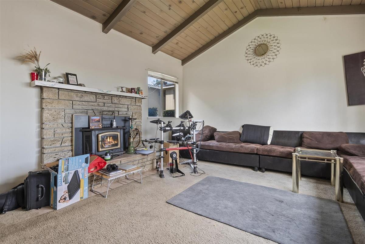 1367-1371 South Wolfe Road Sunnyvale, CA 94087 - Photo 7 of 47 a living room with furniture and a fireplace