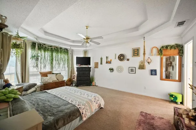 a bed room with a bed and a television