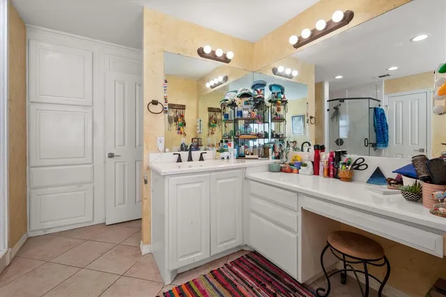 a bathroom with a sink a vanity and a mirror