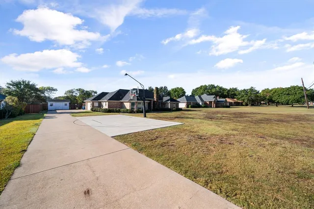 a view of swimming pool with a yard