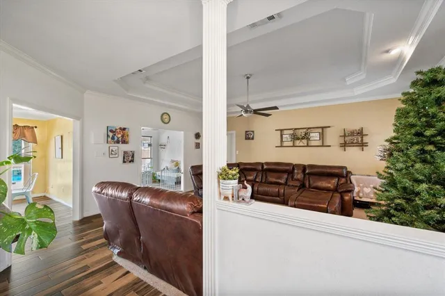 a living room with furniture and flowers