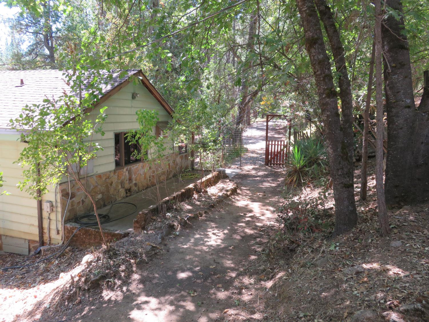 2563 Woodhouse Mine Road West Point, CA 95255 - Photo 14 of 49 a front view of a house with garden