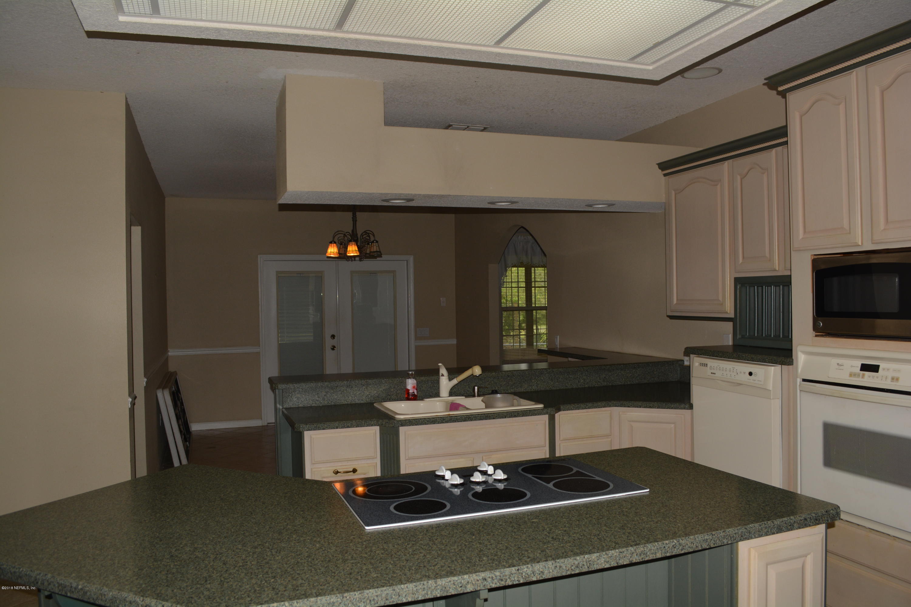 4203 Raintree Drive Macclenny, FL 32063 - Photo 12 of 26 Kitchen through to Dining