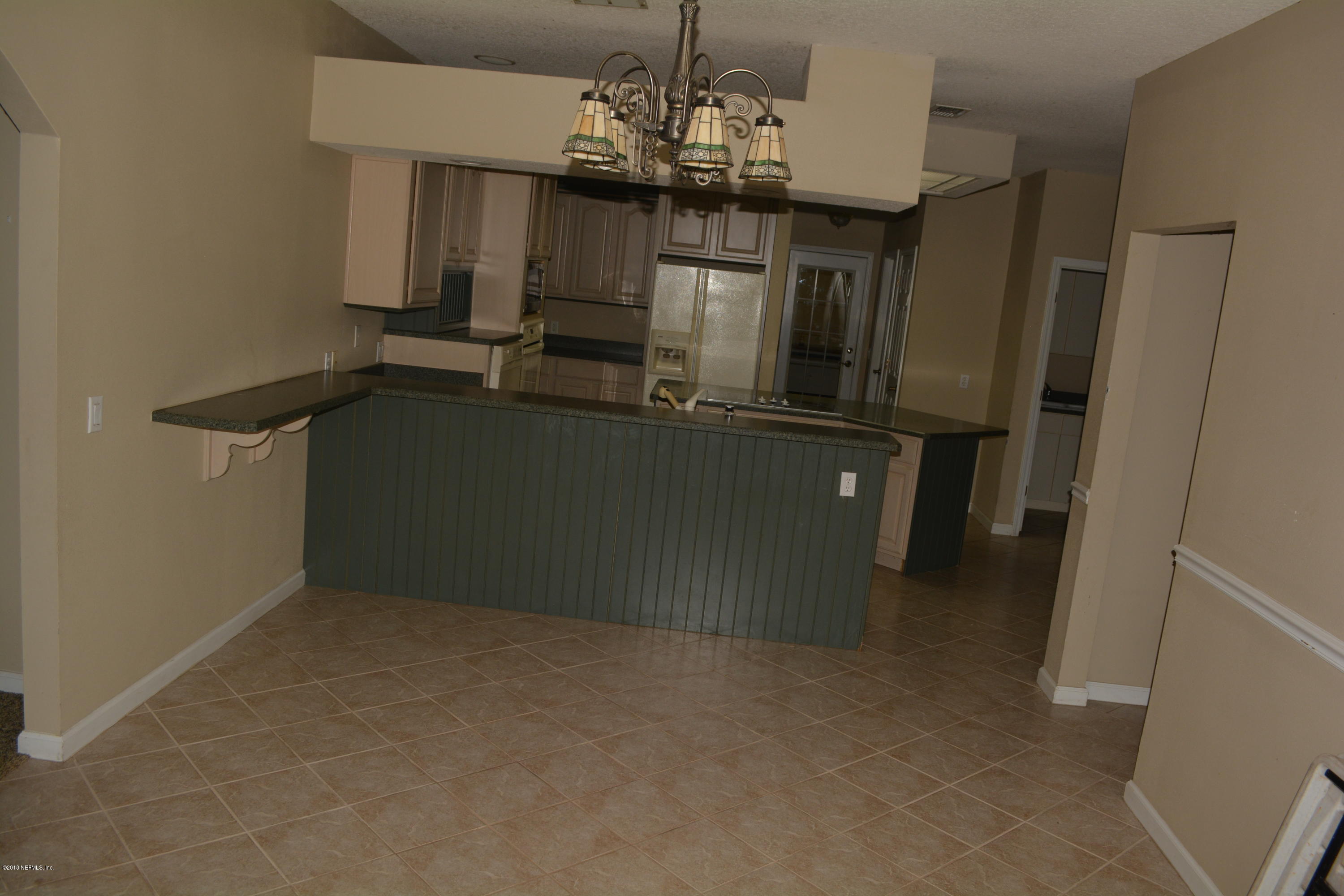 4203 Raintree Drive Macclenny, FL 32063 - Photo 17 of 26 Dining through to kitchen