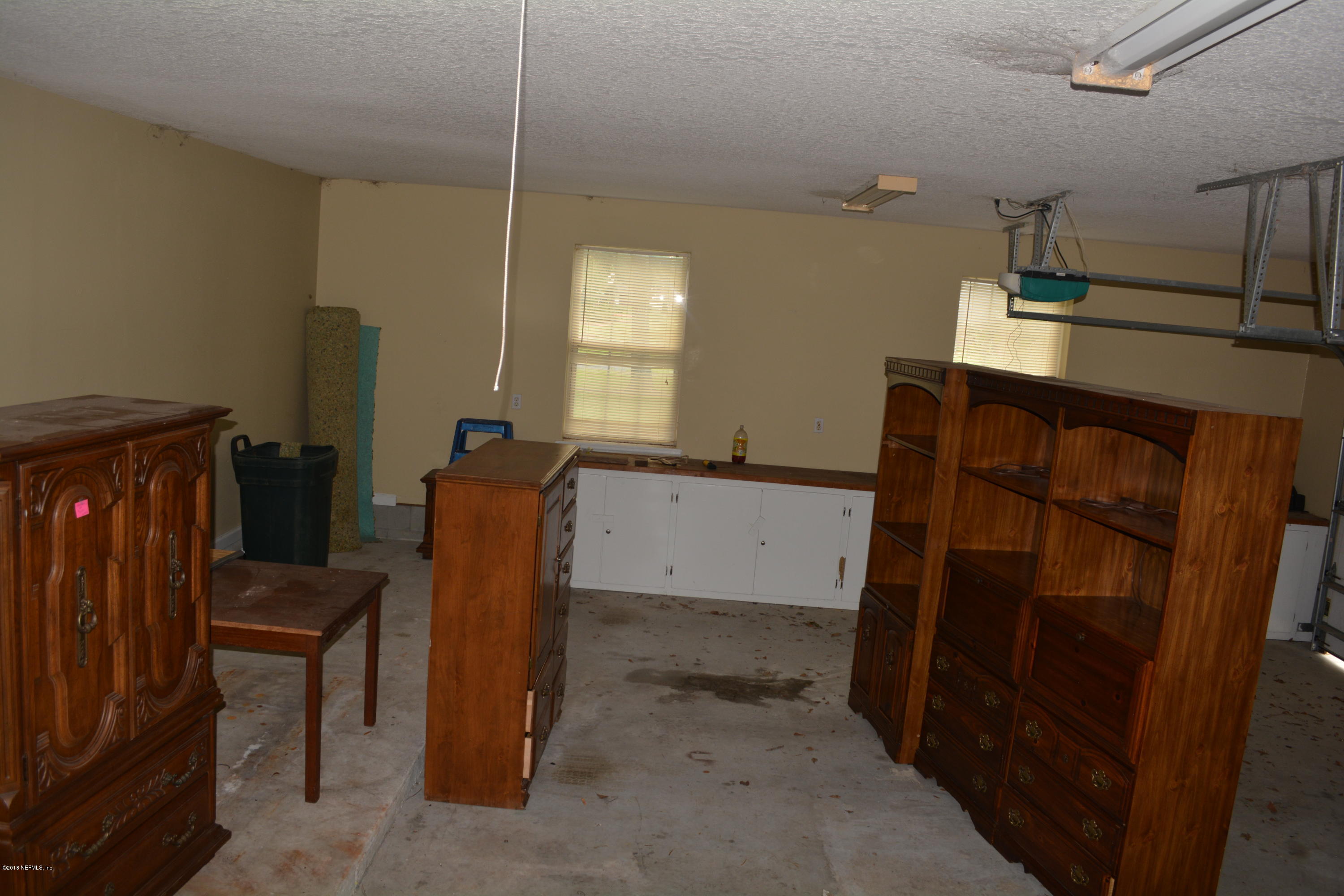 4203 Raintree Drive Macclenny, FL 32063 - Photo 26 of 26 Large Garage/ additional cabinet storage