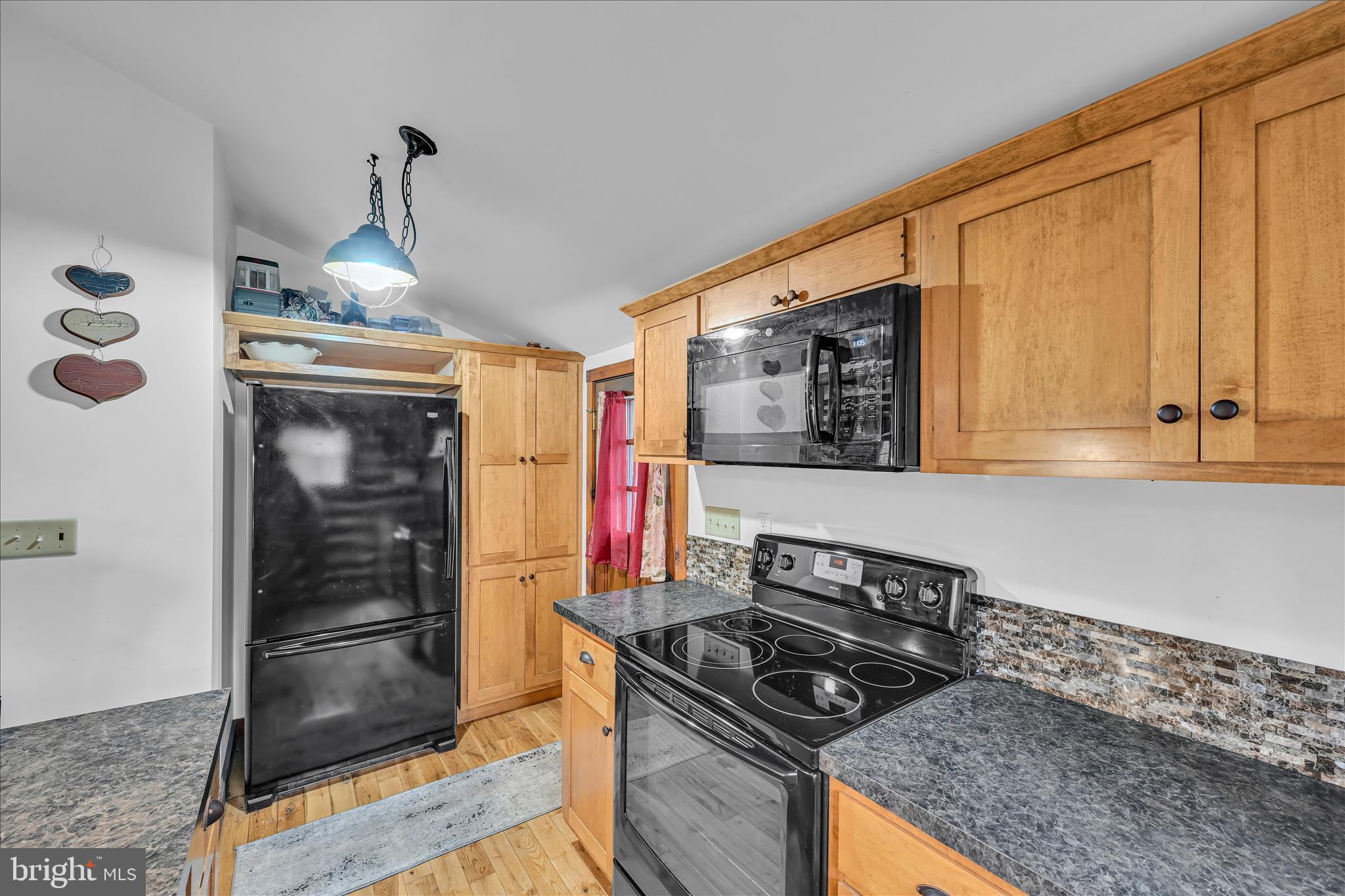 16 Short Lane Jonestown, PA 17038 - Photo 21 of 36 a kitchen with granite countertop a stove and a sink
