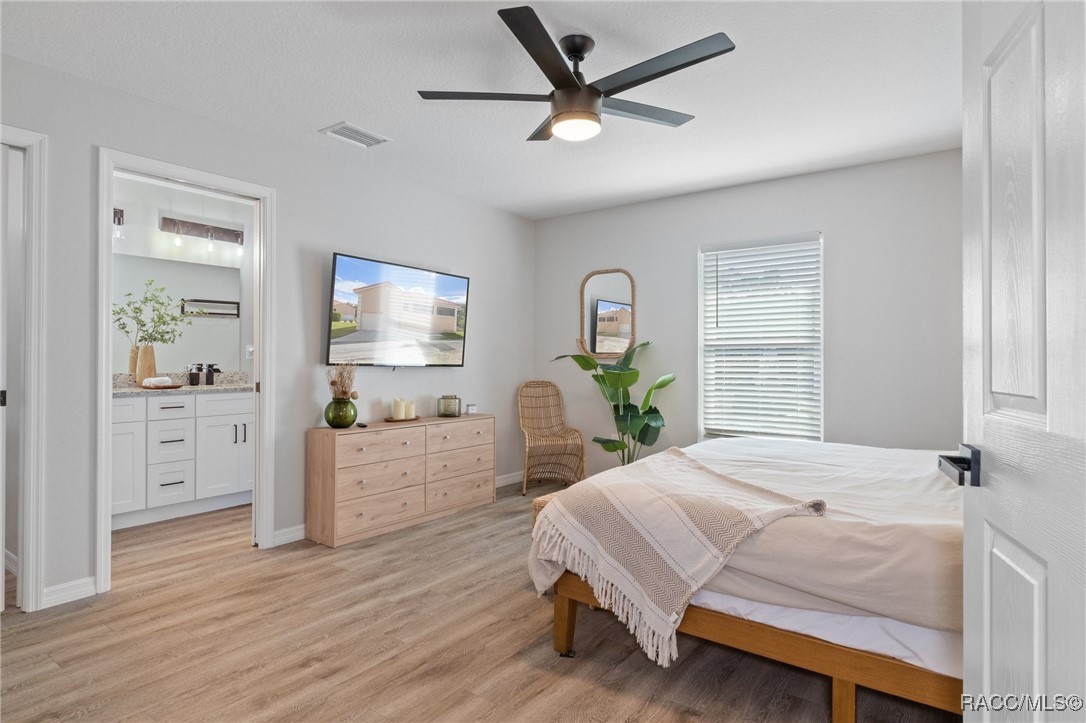 4865 South Tromp Loop Homosassa, FL 34448 - Photo 10 of 30 a bedroom with a bed window and table