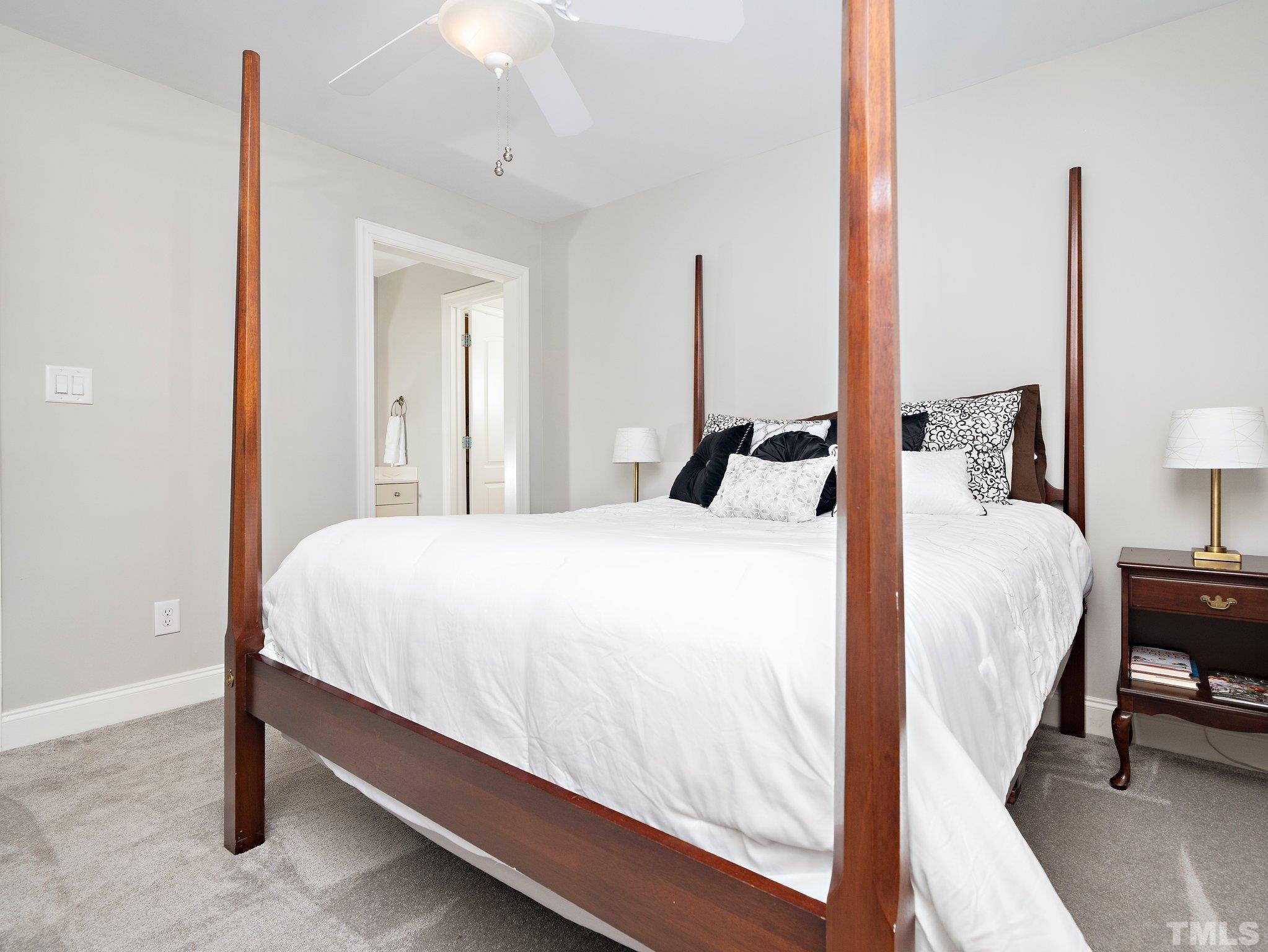 2717 Peachleaf Street Raleigh, NC 27614 - Photo 23 of 42 a bedroom with a bed and a night stand