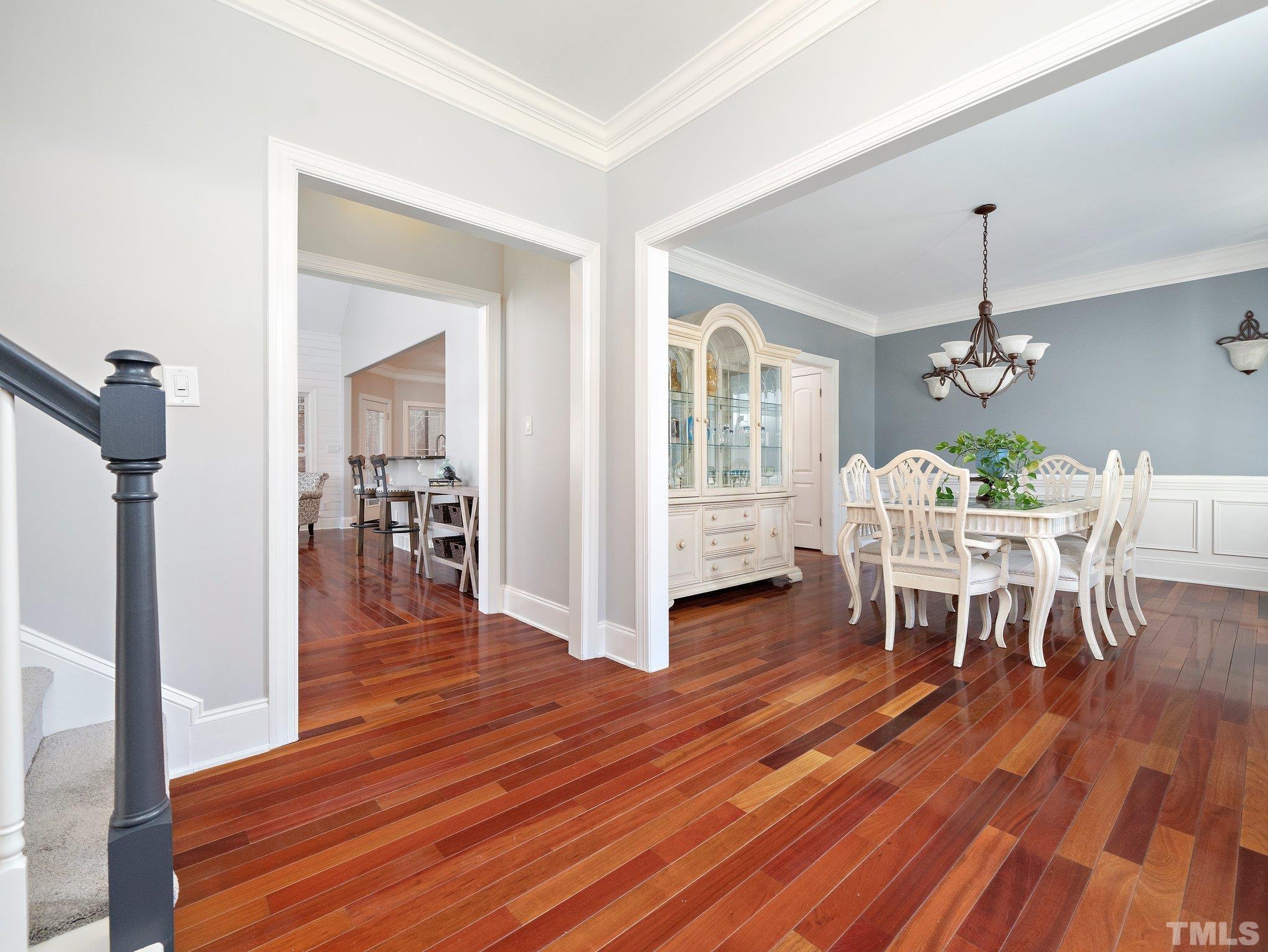 2717 Peachleaf Street Raleigh, NC 27614 - Photo 4 of 42 a view of a dining room with furniture and wooden floor