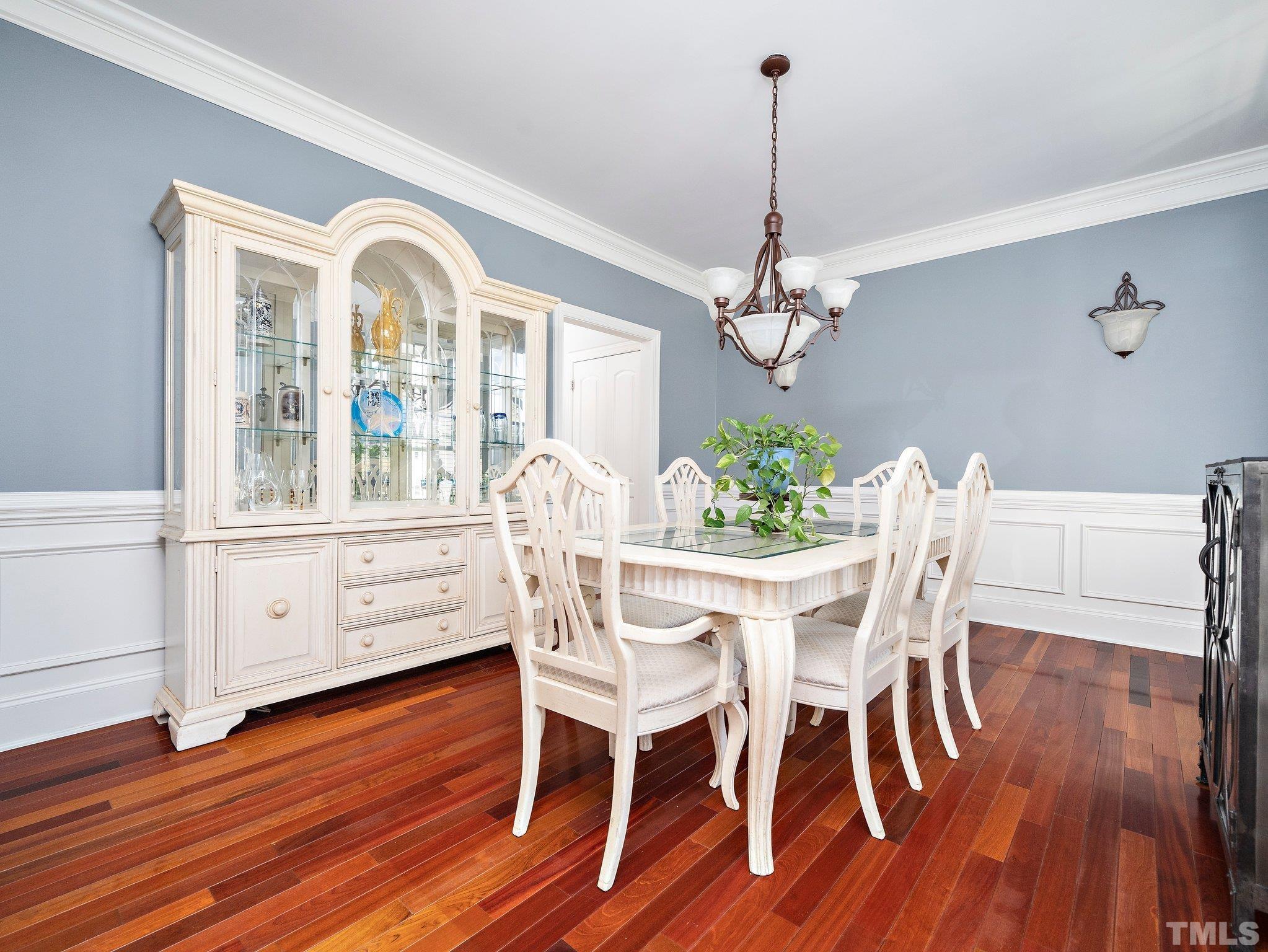 2717 Peachleaf Street Raleigh, NC 27614 - Photo 5 of 42 a view of a dining room with furniture window and wooden floor