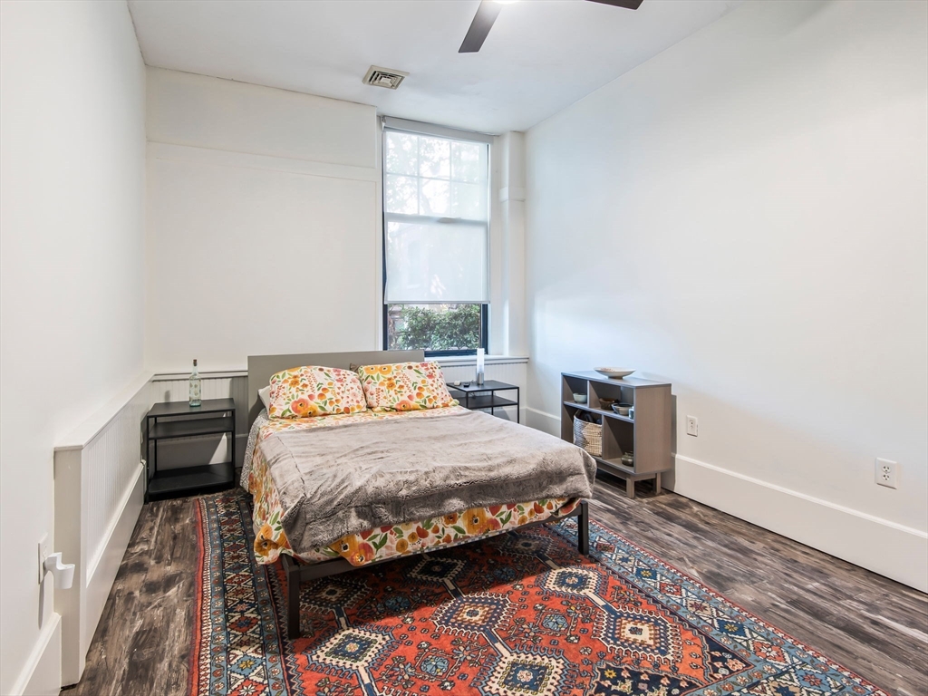 28 Adams Street, Unit 102 Worcester, MA 01604 - Photo 14 of 34 a bedroom with a bed and a window