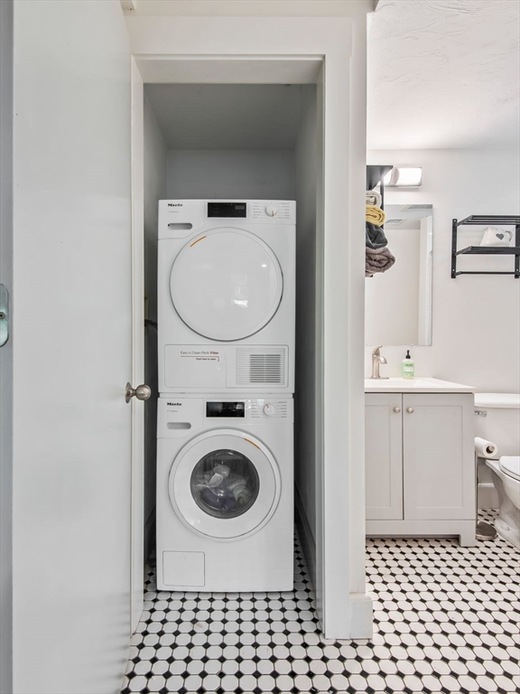 28 Adams Street, Unit 102 Worcester, MA 01604 - Photo 17 of 34 a bathroom with a sink a toilet and a mirror
