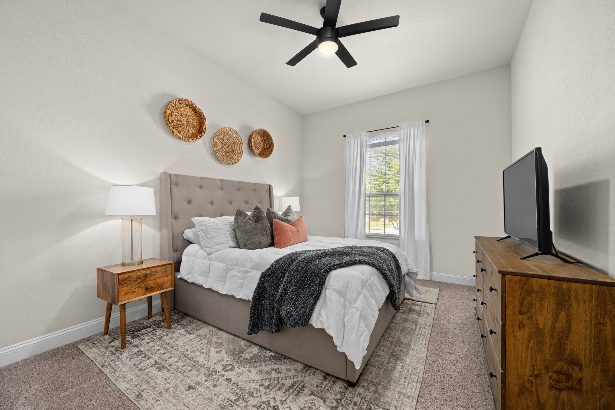 2100 Highland Ridge Road Georgetown, TX 78628 - Photo 20 of 30 A well-lit bedroom featuring a ceiling fan and ample natural light from a window.