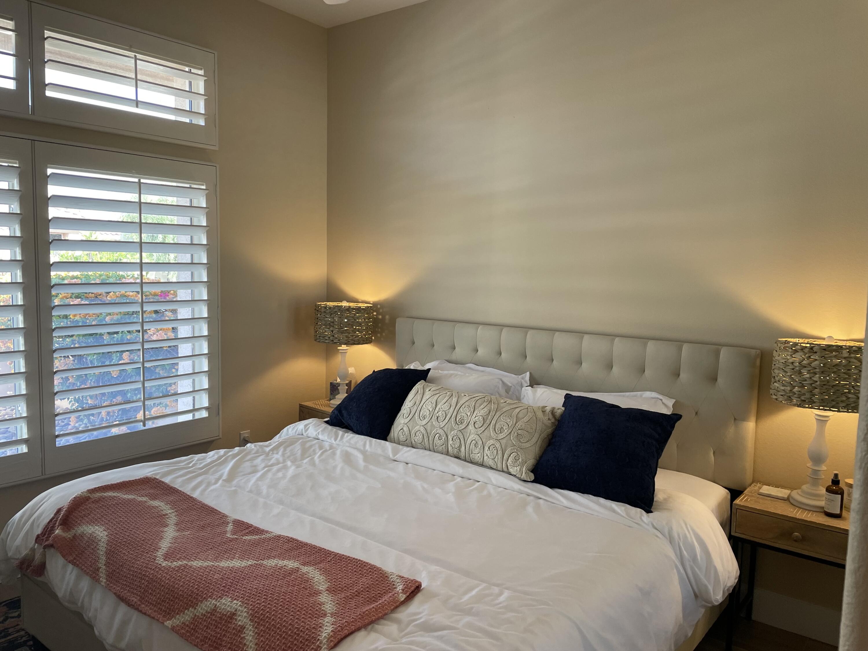 38286 Brandywine Avenue Palm Desert, CA 92211 - Photo 12 of 22 a bedroom with a bed and wooden floor